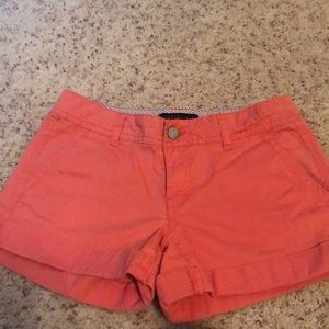 Orange/coral colored shorts